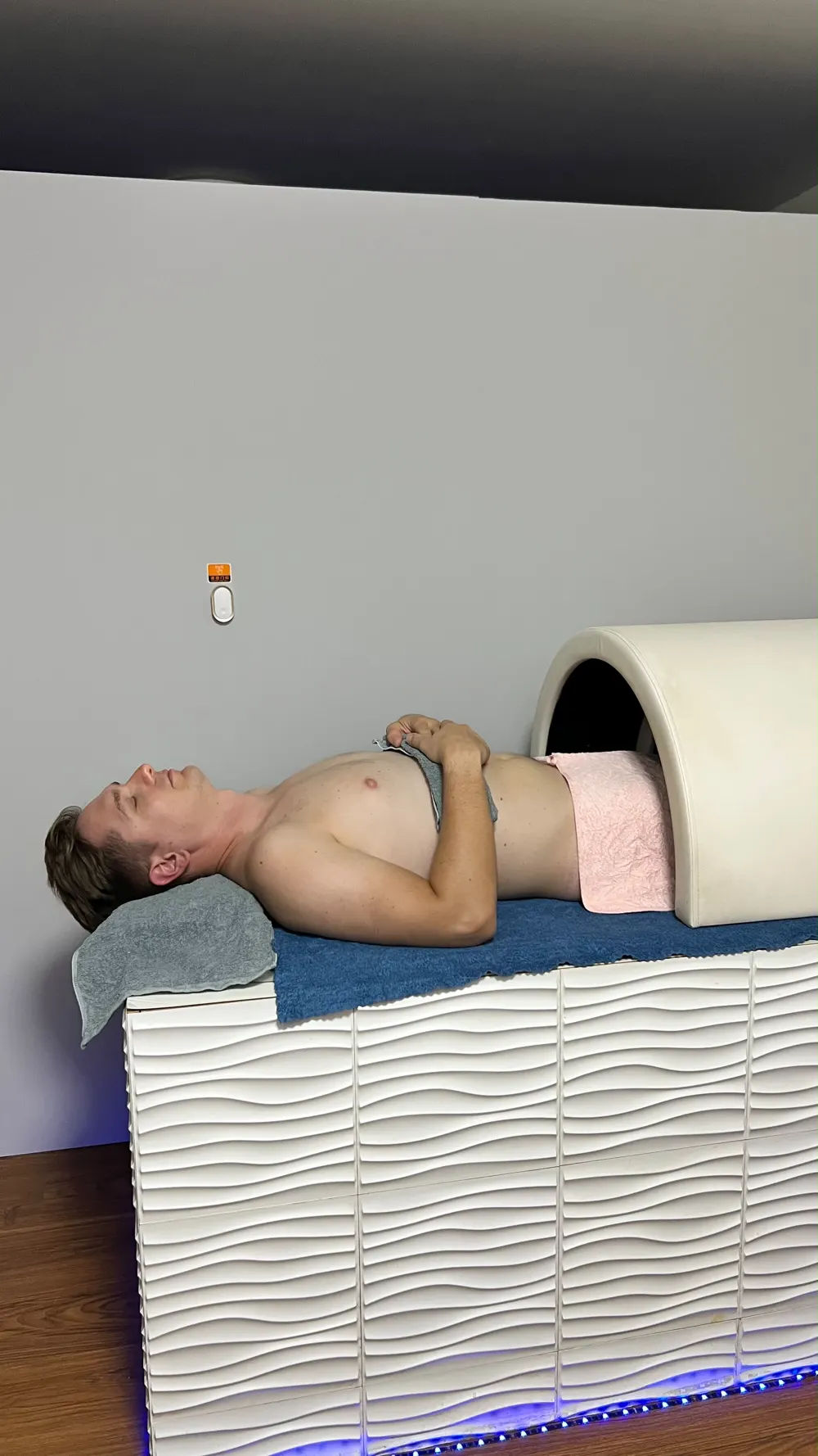 Guest relaxing in the sauna pod