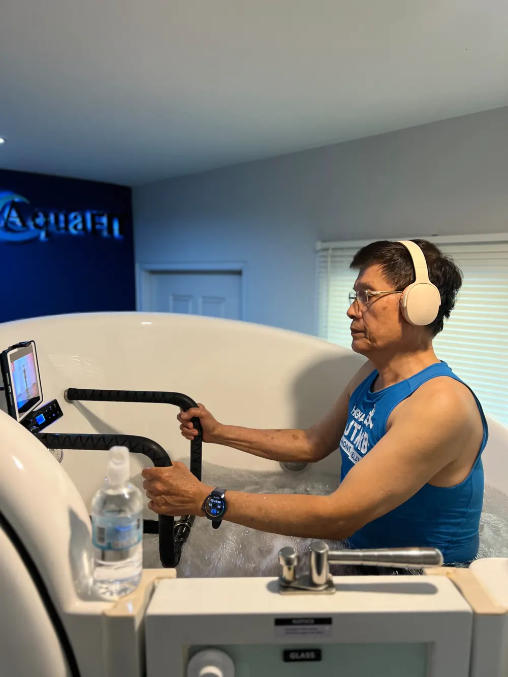 Senior rider pedalling with headphones